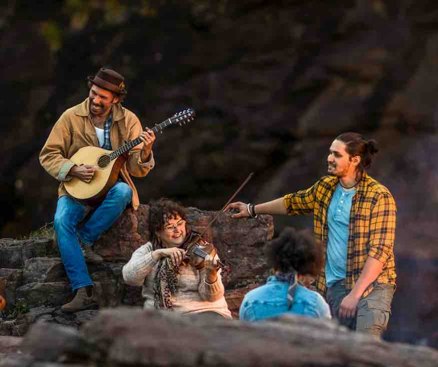 Playing guitar at Middle Cove.