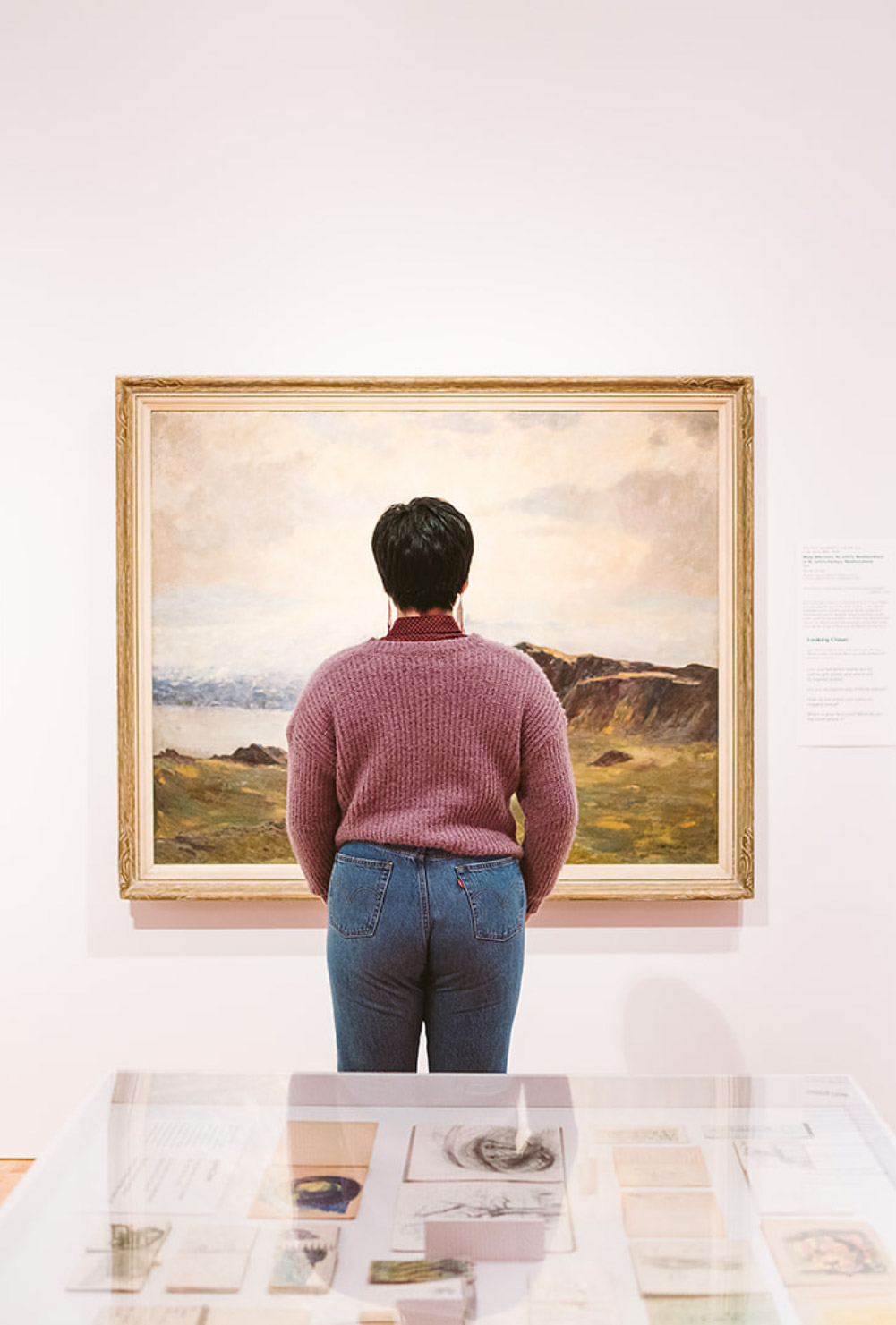 Woman looking at a painting in The Rooms, an art gallery and museum in St. John’s
