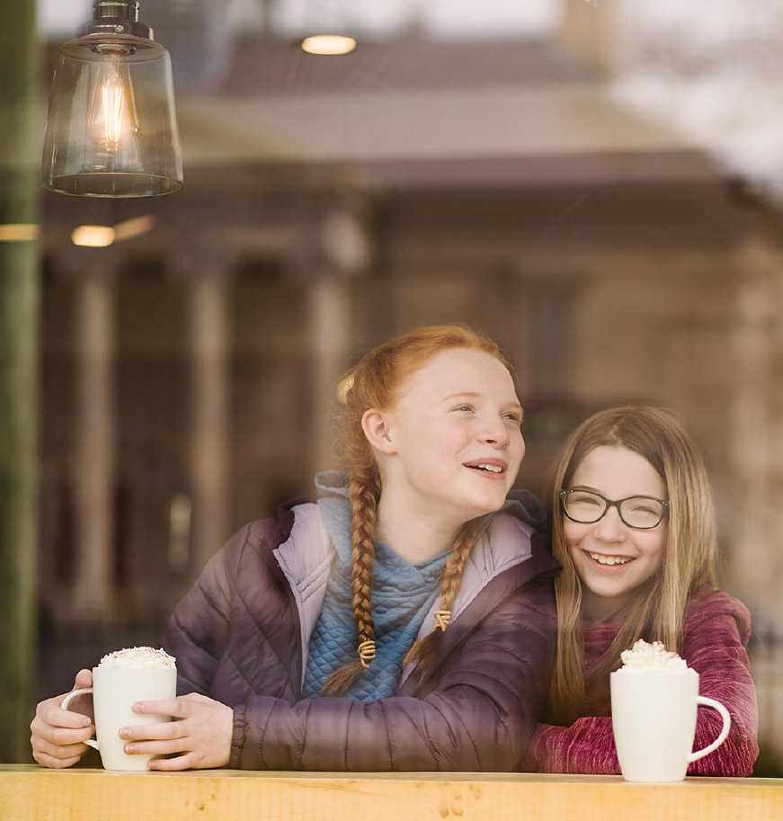 Two children enjoying warm drinks at The Parlour Café in St. John’s
