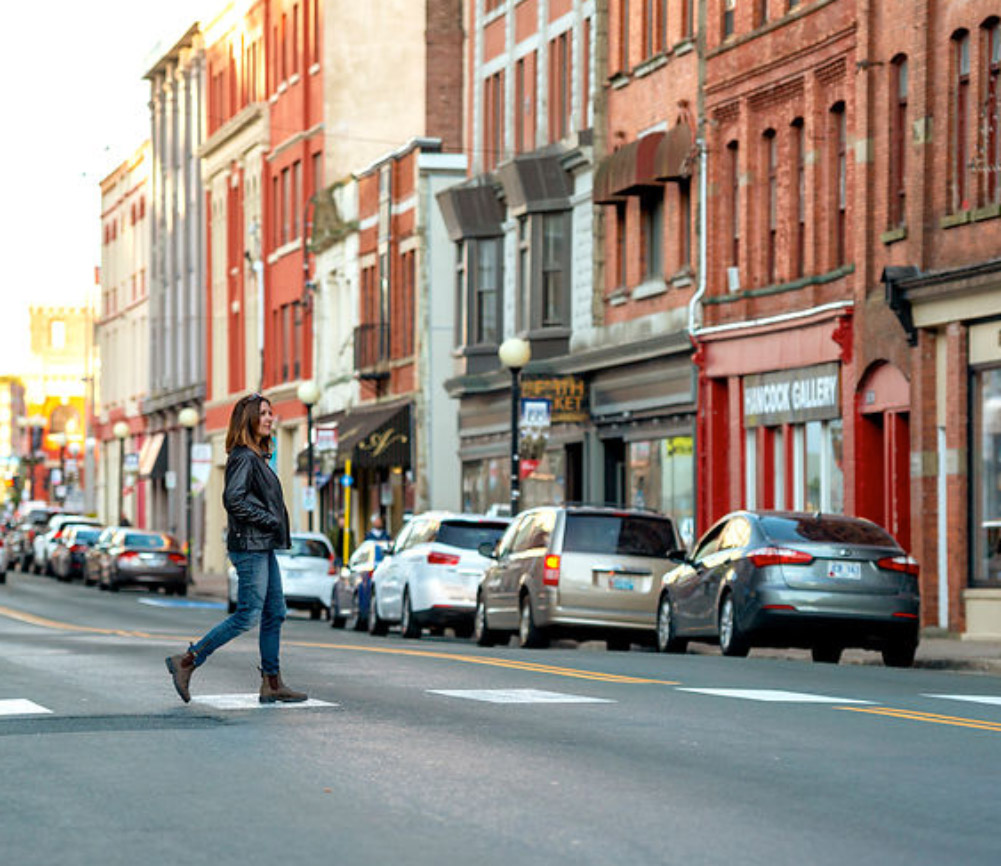 Woman enjoying a casual stroll at a pedestrian walkway on Water Street in St. John’s